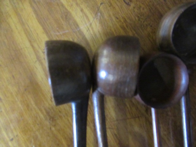 FIVE 19TH CENTURY TREEN TODDY LADLES each with rounded bowl and protruding lip, three with rounded Image