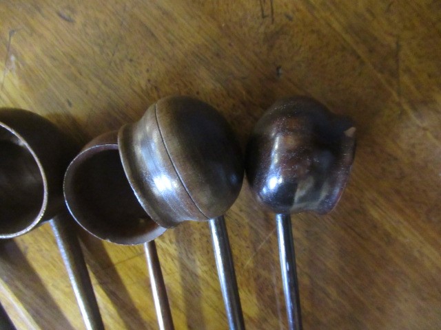FIVE 19TH CENTURY TREEN TODDY LADLES each with rounded bowl and protruding lip, three with rounded Image