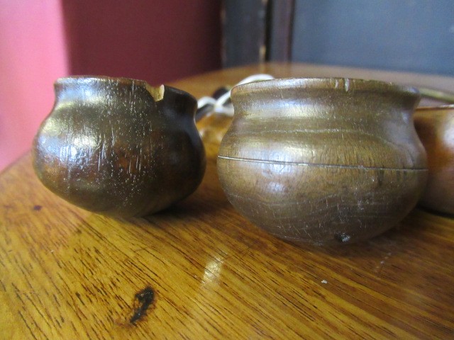 FIVE 19TH CENTURY TREEN TODDY LADLES each with rounded bowl and protruding lip, three with rounded Image