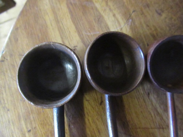 FIVE 19TH CENTURY TREEN TODDY LADLES each with rounded bowl and protruding lip, three with rounded Image