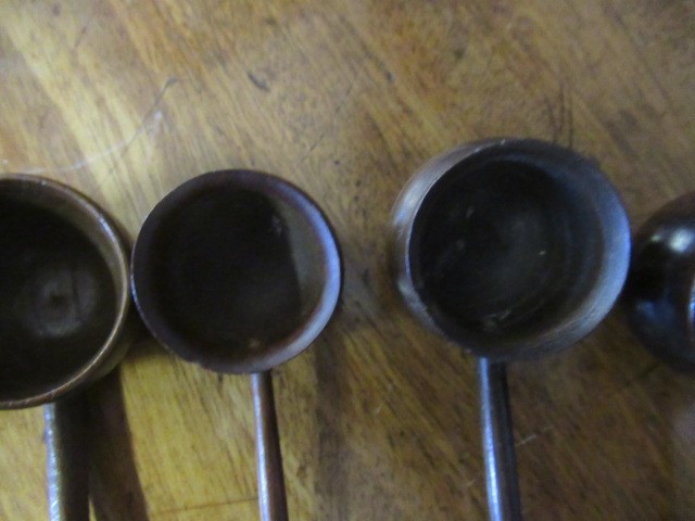 FIVE 19TH CENTURY TREEN TODDY LADLES each with rounded bowl and protruding lip, three with rounded Image