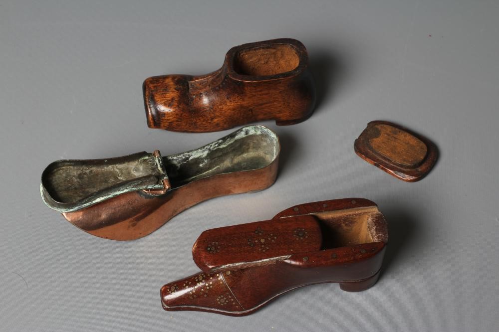 A 19TH CENTURY MAHOGANY SHOE SNUFF BOX with sliding cover and brass tack pique work to the front and Image