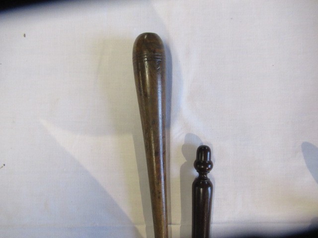 A COLLECTION OF 19TH CENTURY TREEN, comprising of a baton, scroll holder, sailor's fid, candlestick Image