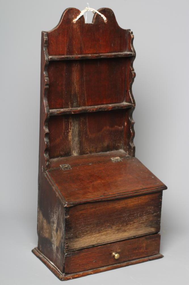 A 19TH CENTURY OAK WALL MOUNTED SPOON RACK with shaped cresting rail and two shelves for spoons Image