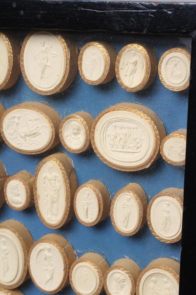 A COLLECTION OF FIFTY EIGHT ITALIAN 19TH CENTURY GRAND TOUR PLASTER INTAGLIO MEDALLIONS, depicting Image