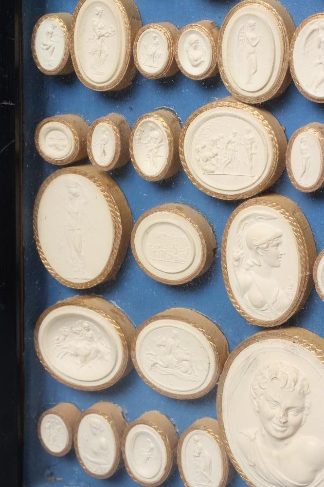 A COLLECTION OF FIFTY EIGHT ITALIAN 19TH CENTURY GRAND TOUR PLASTER INTAGLIO MEDALLIONS, depicting Image