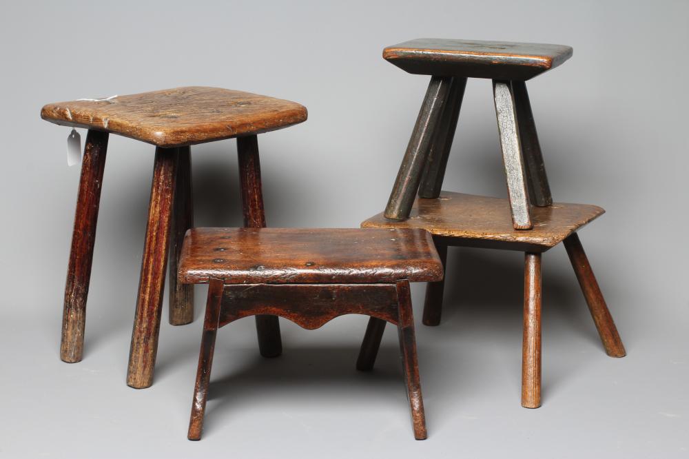 A 19TH CENTURY ASH AND ELM MILKING STOOL, the oblong seat raised on four circular tapering legs, 13 Image