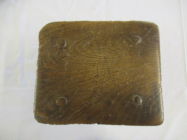 A 19TH CENTURY ASH AND ELM MILKING STOOL, the oblong seat raised on four circular tapering legs, 13 Image