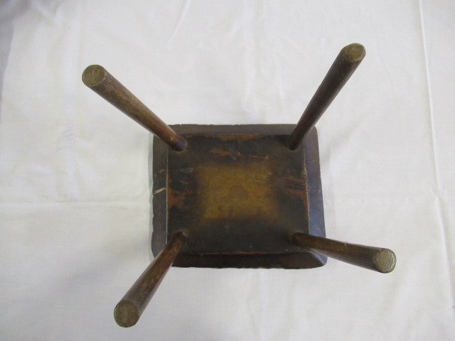 A 19TH CENTURY ASH AND ELM MILKING STOOL, the oblong seat raised on four circular tapering legs, 13 Image