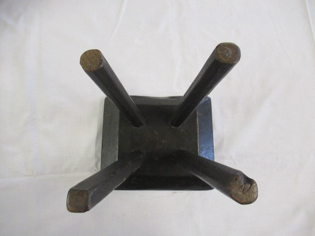 A 19TH CENTURY ASH AND ELM MILKING STOOL, the oblong seat raised on four circular tapering legs, 13 Image