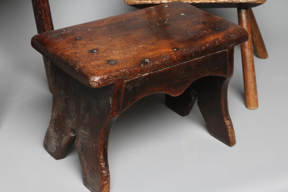 A 19TH CENTURY ASH AND ELM MILKING STOOL, the oblong seat raised on four circular tapering legs, 13 Image
