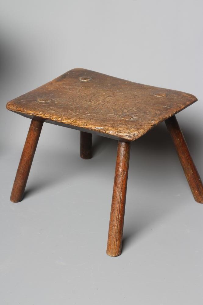 A 19TH CENTURY ASH AND ELM MILKING STOOL, the oblong seat raised on four circular tapering legs, 13 Image
