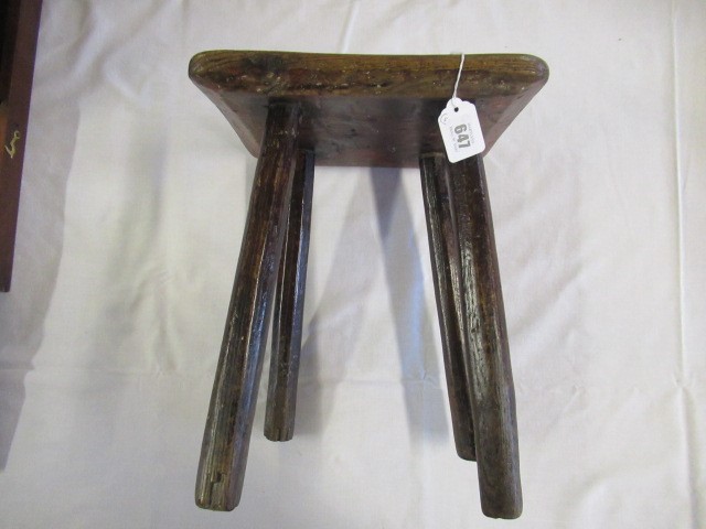 A 19TH CENTURY ASH AND ELM MILKING STOOL, the oblong seat raised on four circular tapering legs, 13 Image