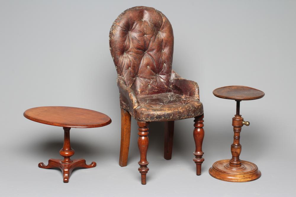 AN EARLY 20TH CENTURY MAHOGANY AND STUDDED LEATHER MINIATURE CHAIR with turned front legs and out Image