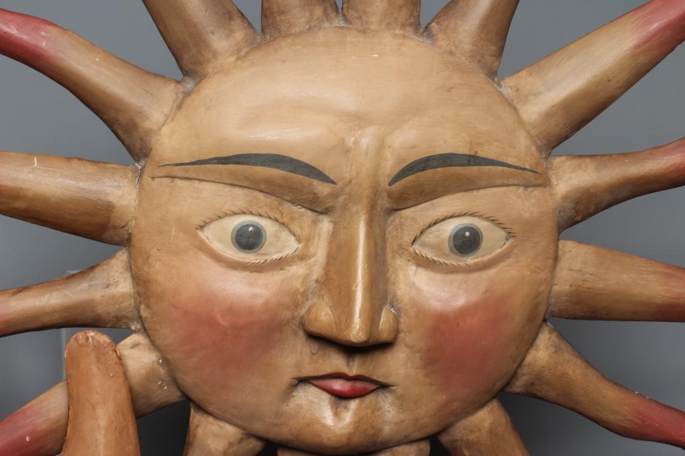 AN EARLY 20TH CENTURY FOLK ART TOLEWARE CRESCENT MOON FACE Image