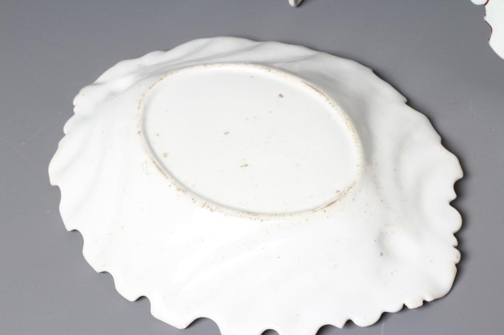 TWO RED ANCHOR PERIOD CHELSEA PORCELAIN SILVER SHAPED DISHES, c.1755, each painted in polychrome Image