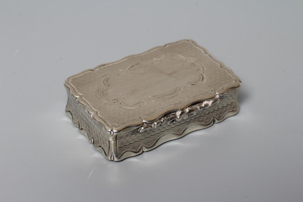 AN EARLY VICTORIAN SILVER SNUFF BOX by George Unite, Birmingham 1854, of shaped oblong form with Image