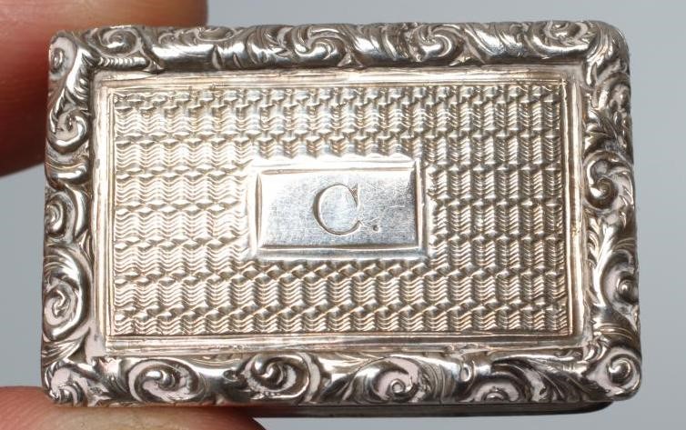 AN EARLY VICTORIAN SILVER SNUFF BOX by George Unite, Birmingham 1854, of shaped oblong form with Image