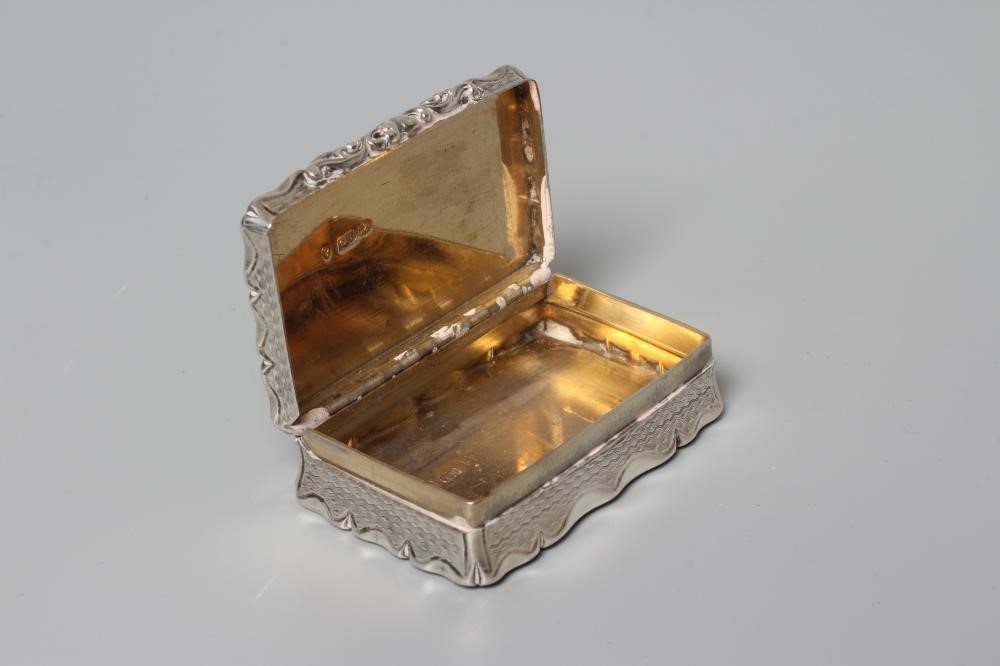 AN EARLY VICTORIAN SILVER SNUFF BOX by George Unite, Birmingham 1854, of shaped oblong form with Image