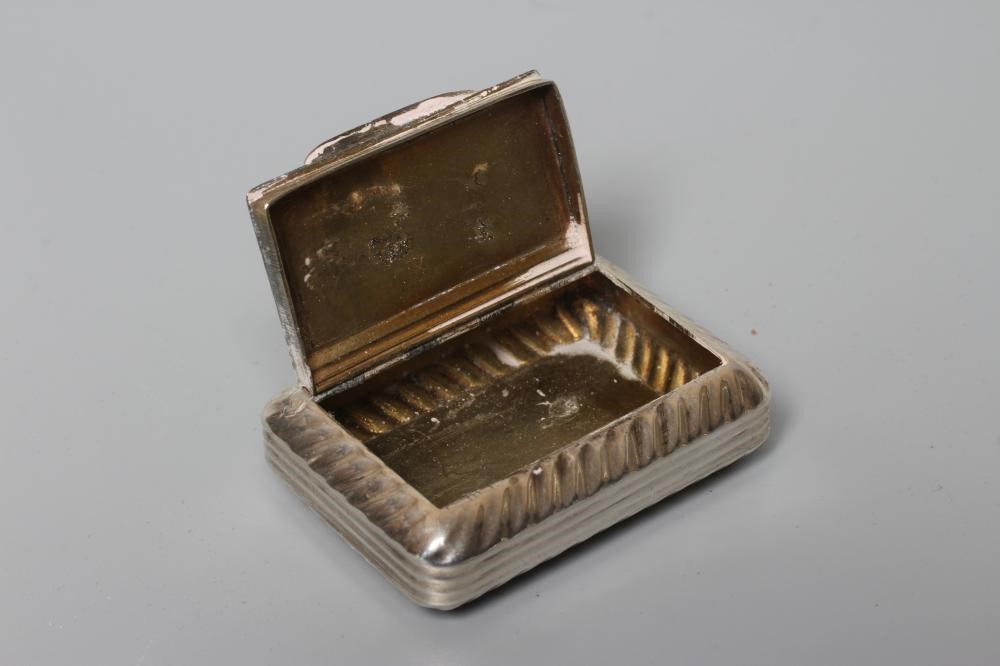 A LATE GEORGE III SILVER SNUFF BOX by William Pugh, Birmingham 1816, of plain rounded oblong form Image