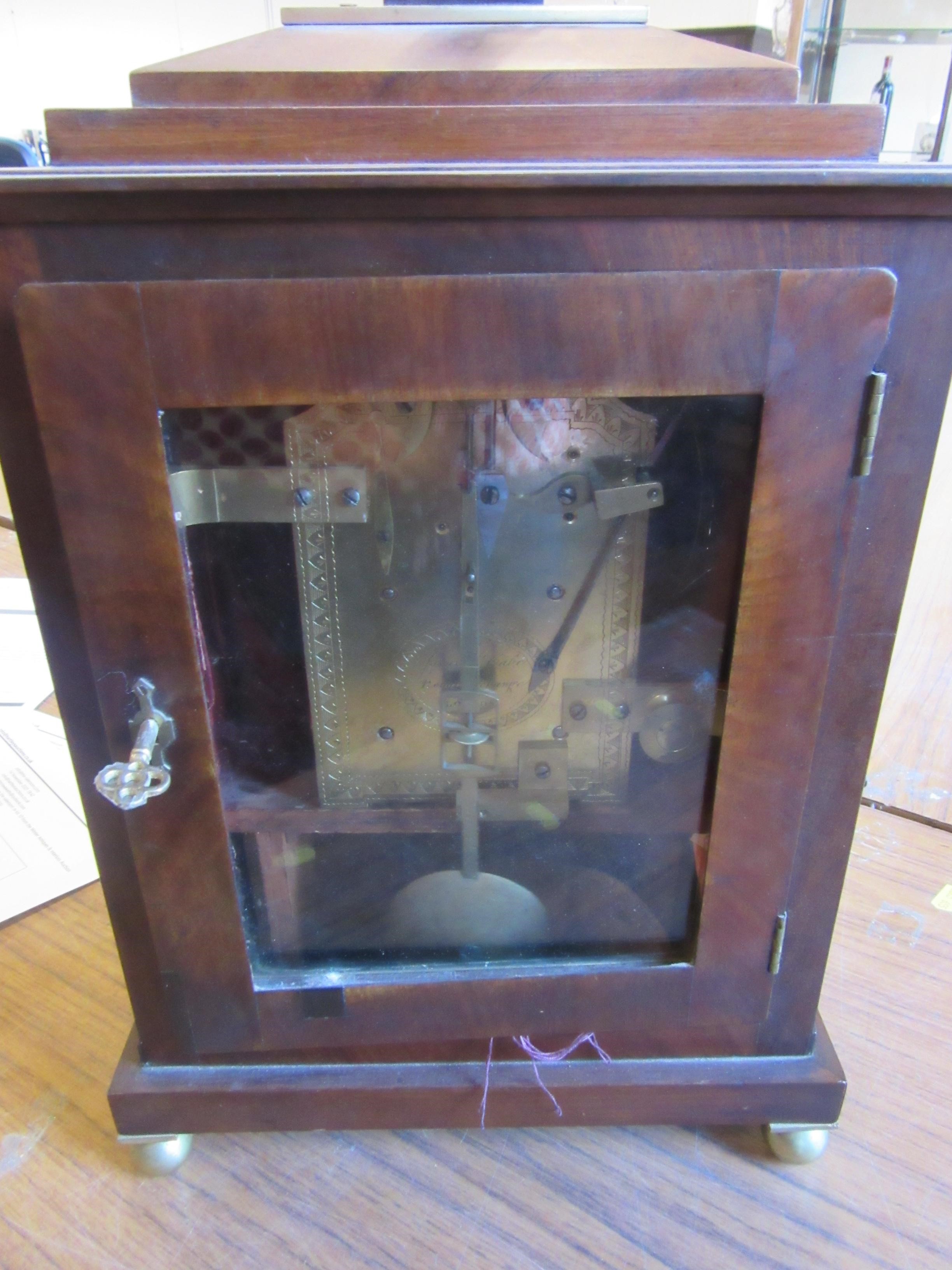 A MAHOGANY CASED MANTEL CLOCK BY JAMES McCABE Image