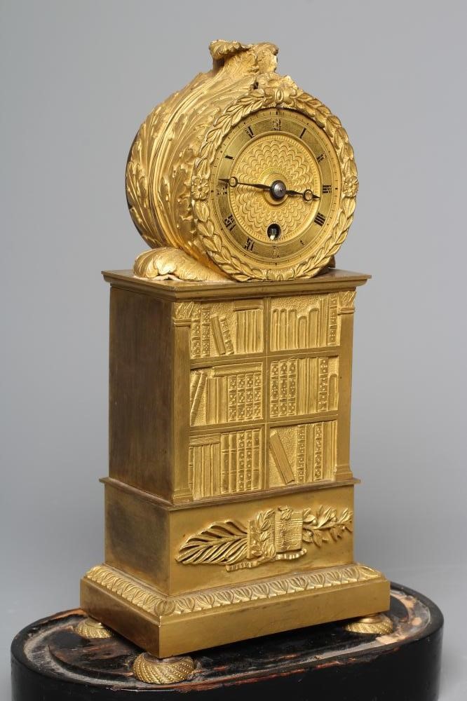 A FRENCH EMPIRE ORMOLU CASED LIBRARY TIMEPIECE Image