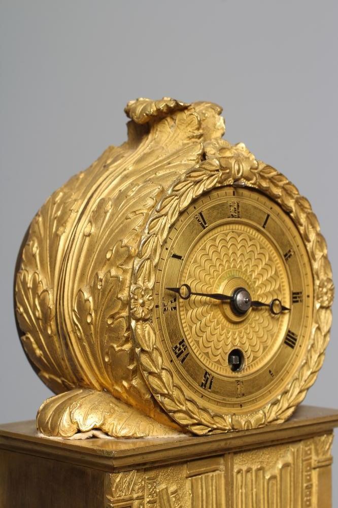 A FRENCH EMPIRE ORMOLU CASED LIBRARY TIMEPIECE Image