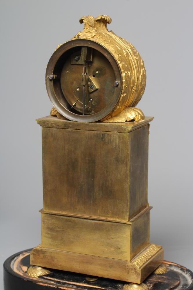 A FRENCH EMPIRE ORMOLU CASED LIBRARY TIMEPIECE Image