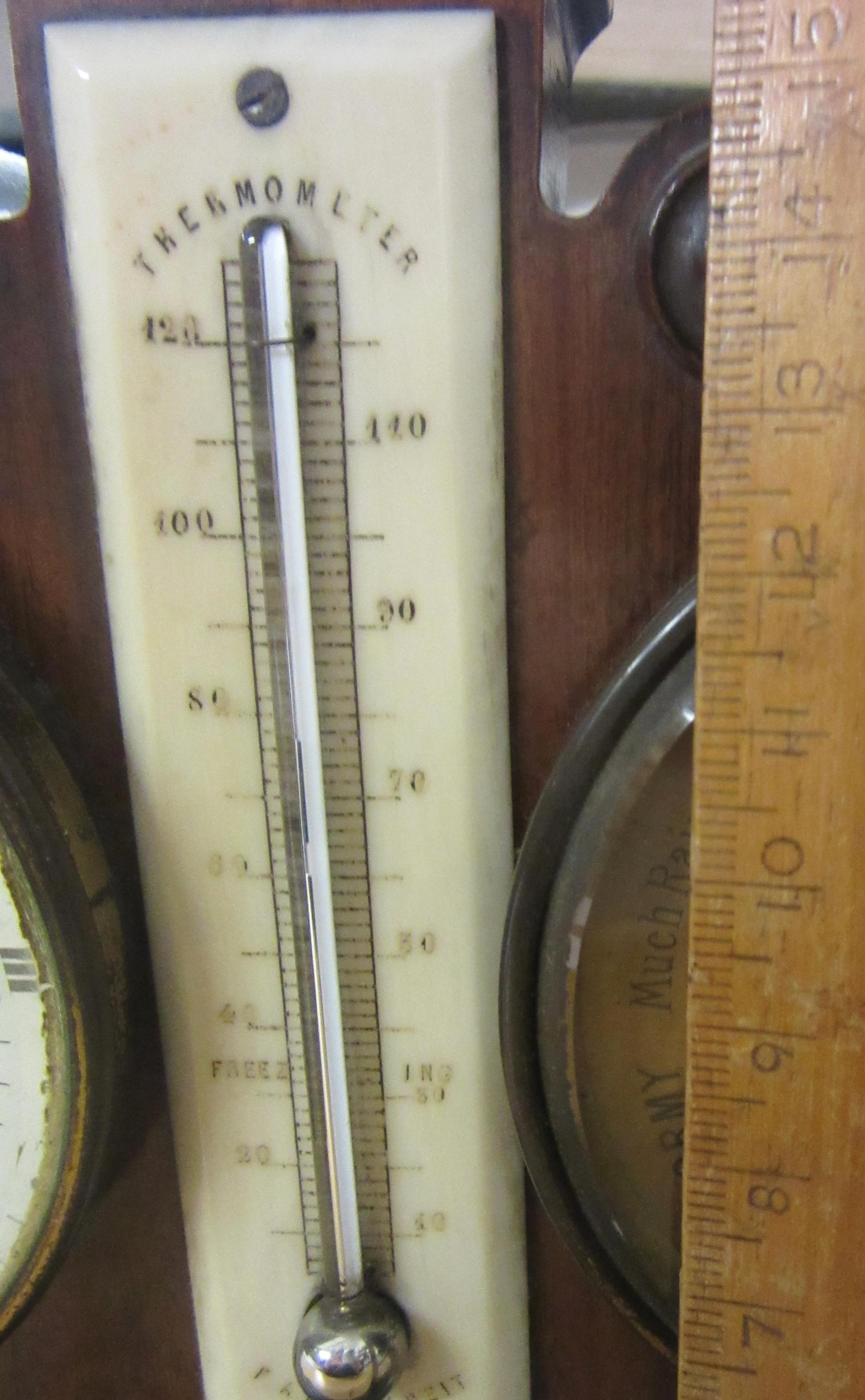 A ROSEWOOD DESK WEATHER STATION Image
