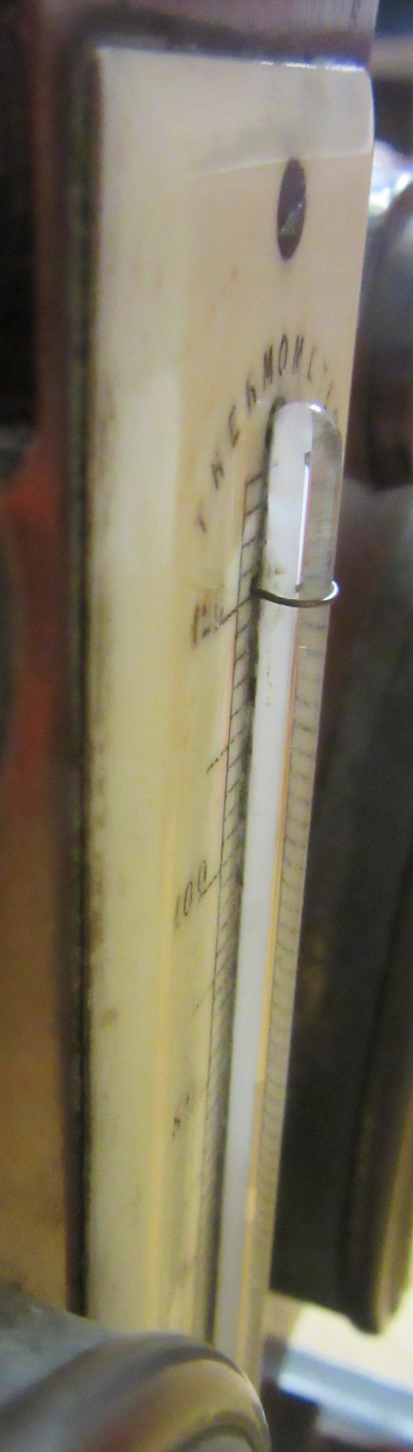 A ROSEWOOD DESK WEATHER STATION Image