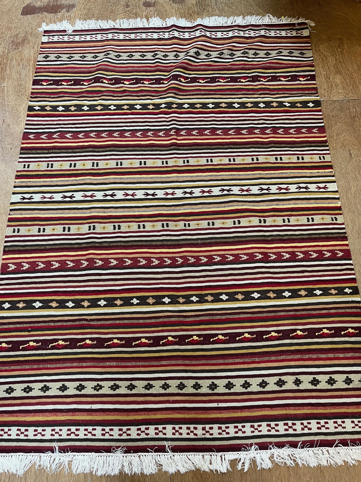 A TURKISH KILM, modern, in all-over striped pattern in shades of red and ivory, 76" x 54" Image