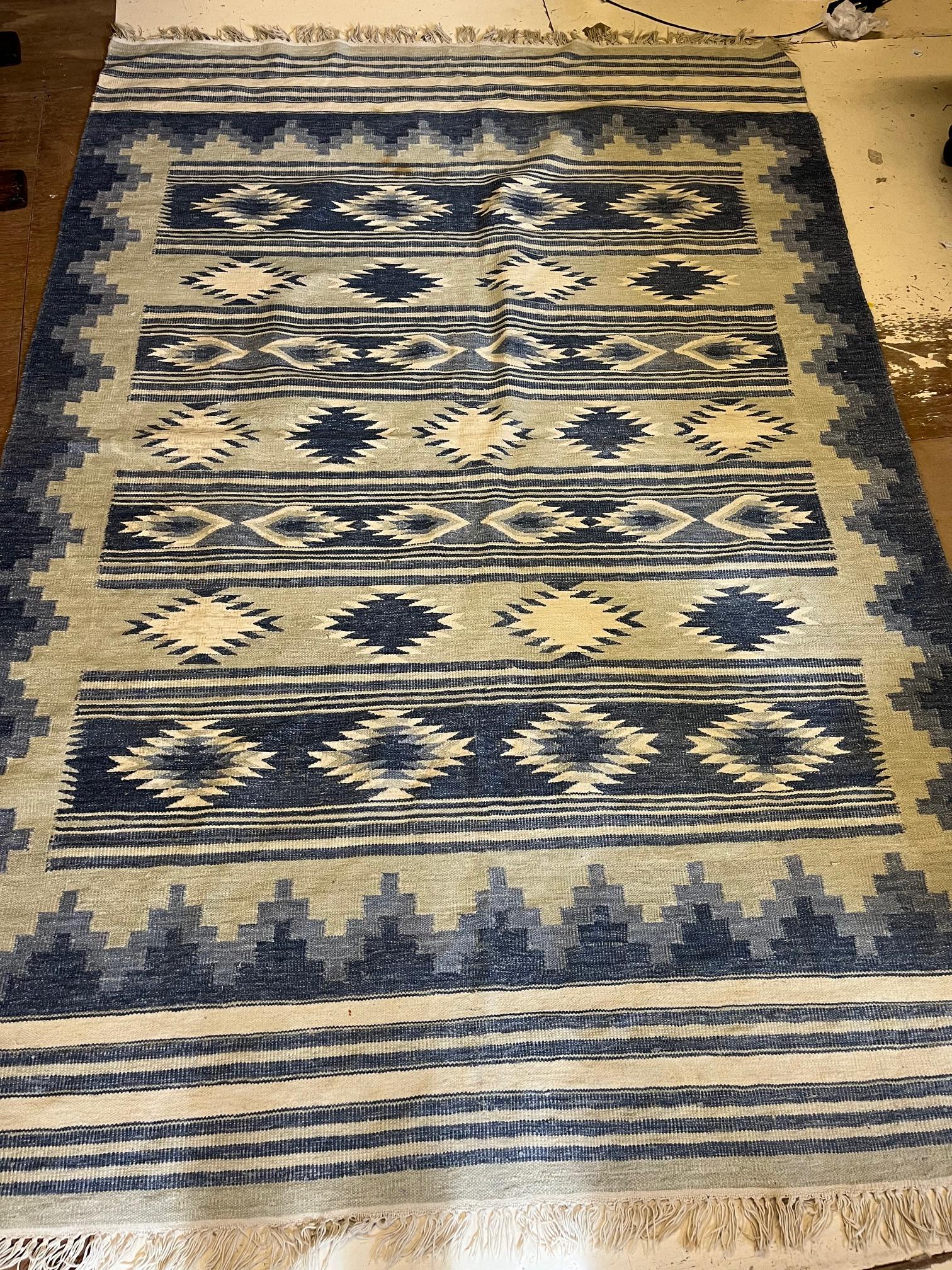 A FLATWEAVE RUG, modern, the striped field with geometric guls in white and shades of blue, 94" x Image