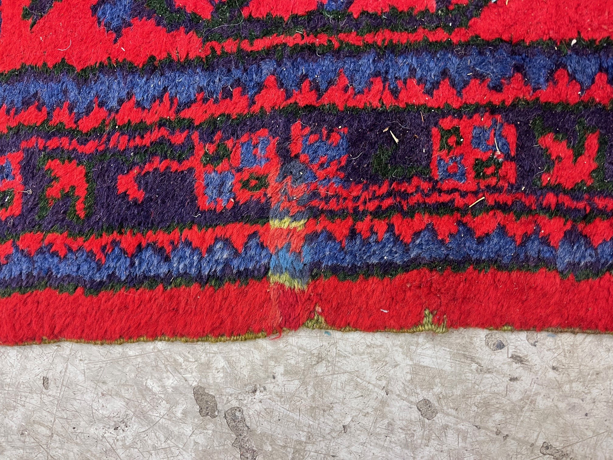 A TURKISH USHAK RED GROUND WOOL CARPET Image