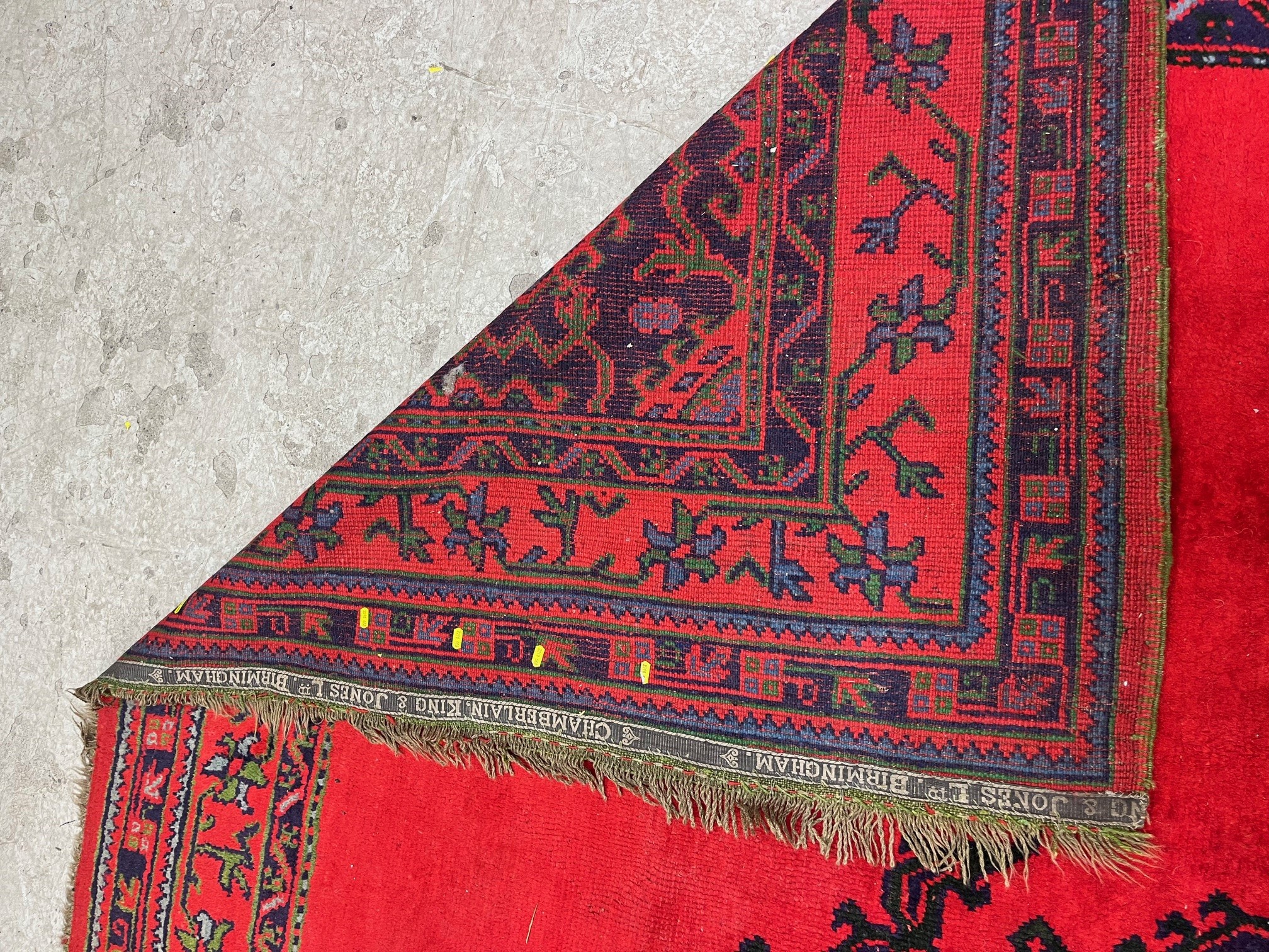 A TURKISH USHAK RED GROUND WOOL CARPET Image