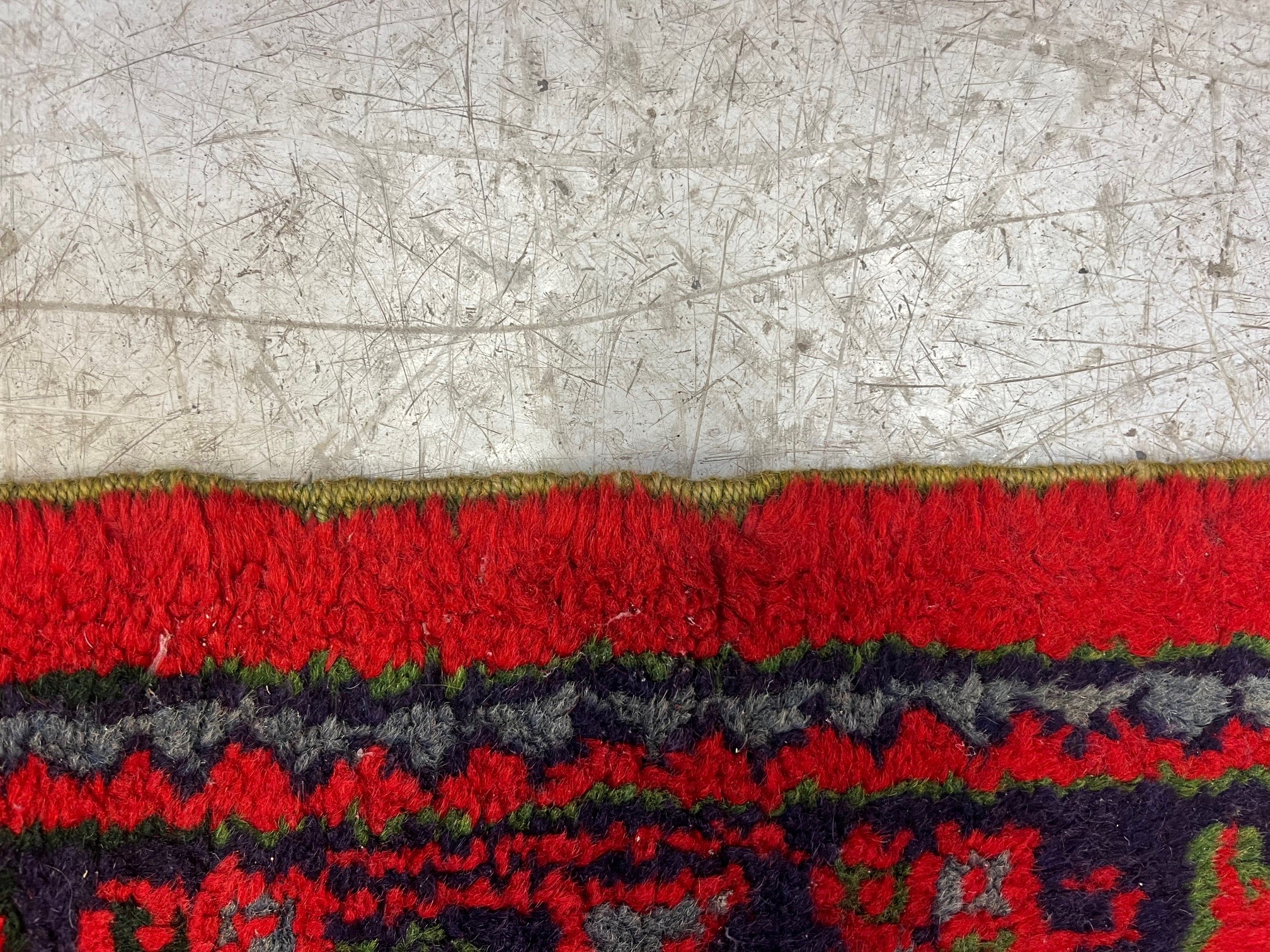 A TURKISH USHAK RED GROUND WOOL CARPET Image