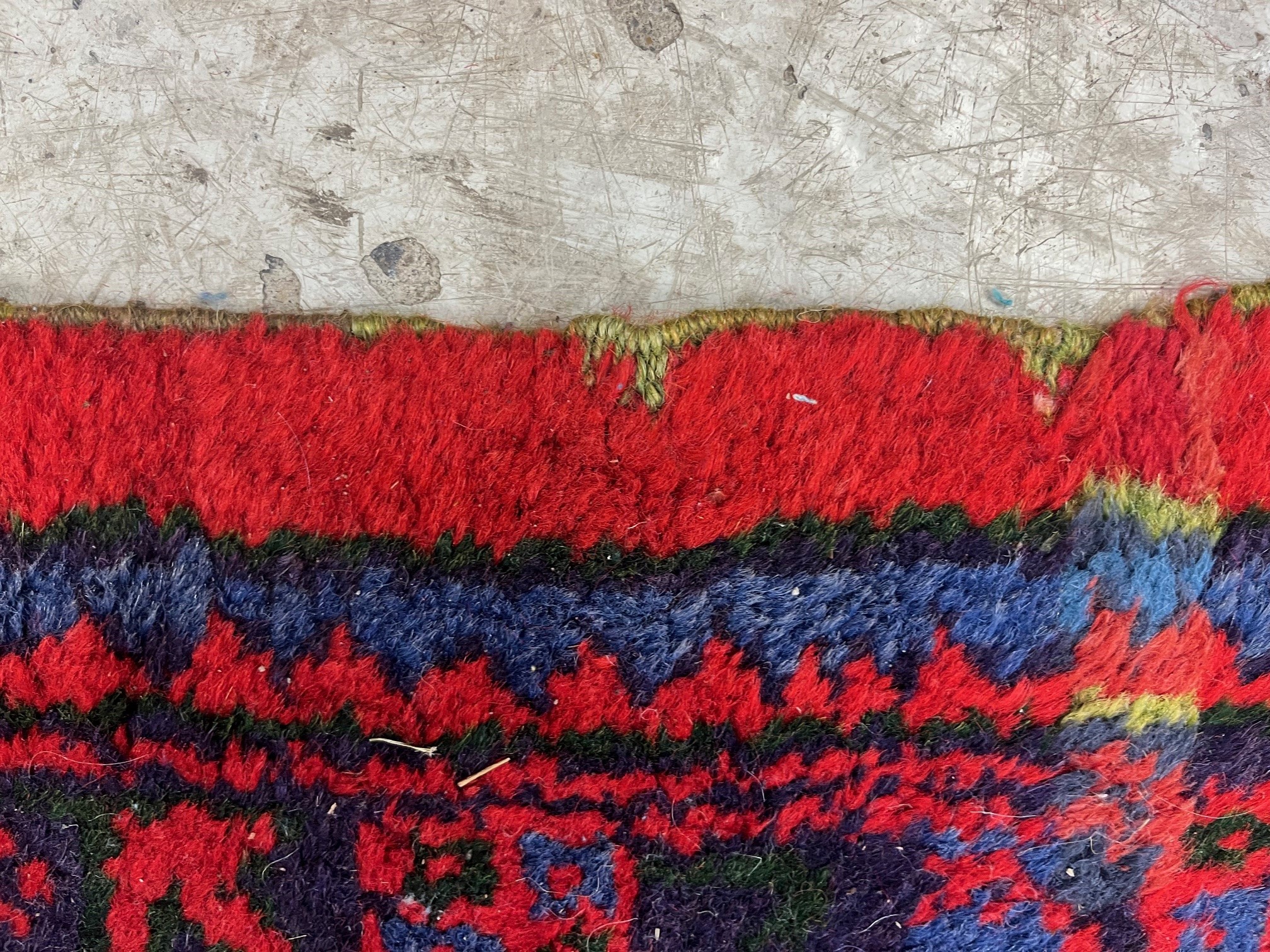A TURKISH USHAK RED GROUND WOOL CARPET Image
