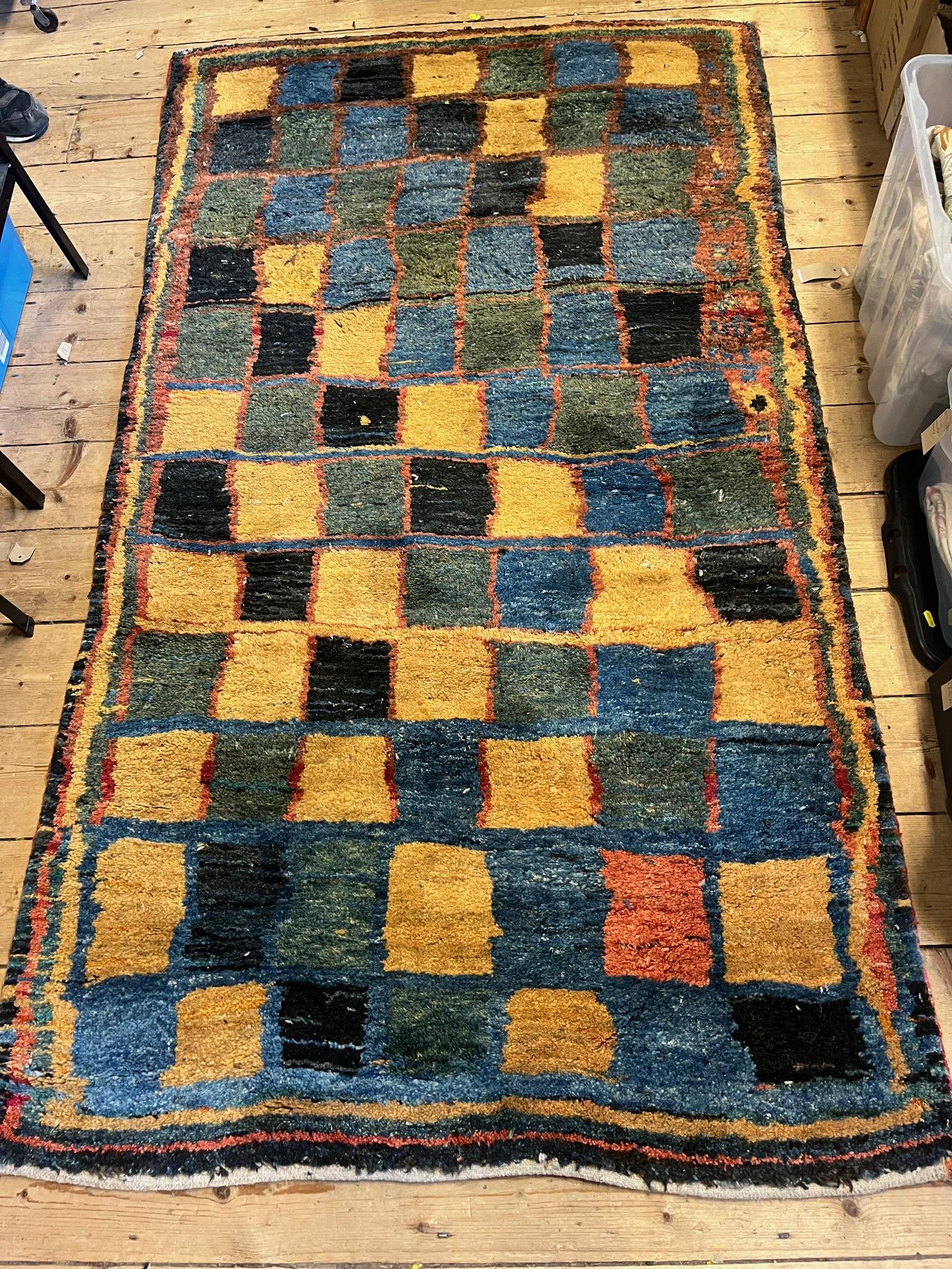 A SOUTH PERSIAN GABBEH RUG, the deep pile with a grid pattern in shades of blue, green, ochre and Image