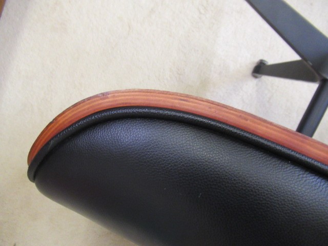 AFTER CHARLES AND RAY EAMES - A MODEL 671 OTTOMAN, modern, in Santos Palisander and black leather, Image