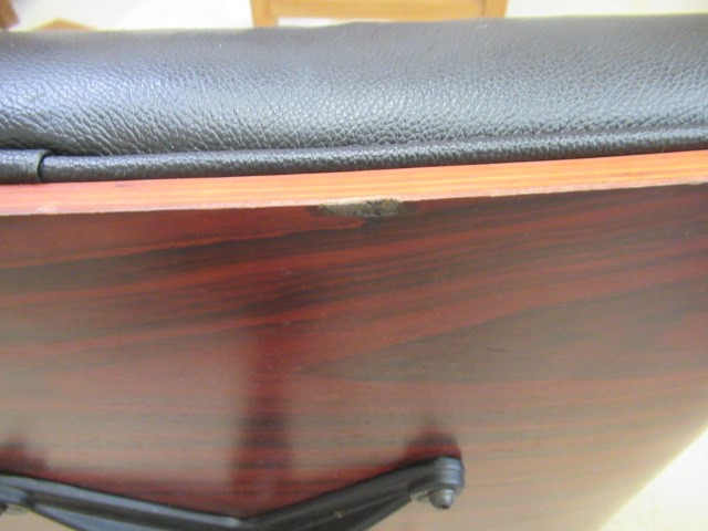 AFTER CHARLES AND RAY EAMES - A MODEL 671 OTTOMAN, modern, in Santos Palisander and black leather, Image