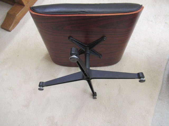 AFTER CHARLES AND RAY EAMES - A MODEL 671 OTTOMAN, modern, in Santos Palisander and black leather, Image