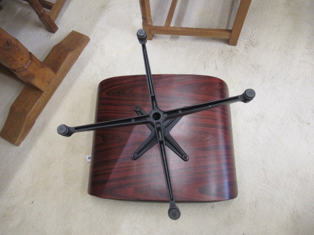 AFTER CHARLES AND RAY EAMES - A MODEL 671 OTTOMAN, modern, in Santos Palisander and black leather, Image