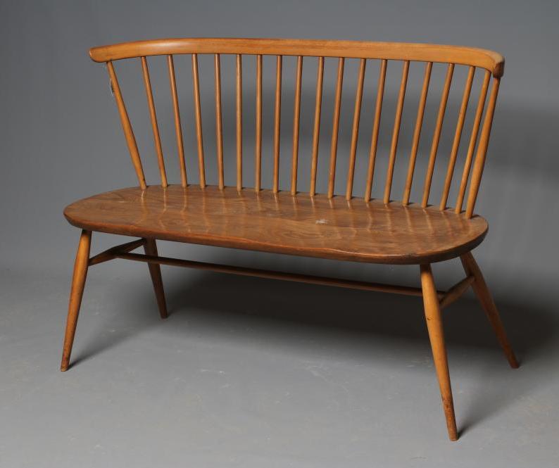 AN ERCOL BEECH AND ELM LOVE SEAT Image