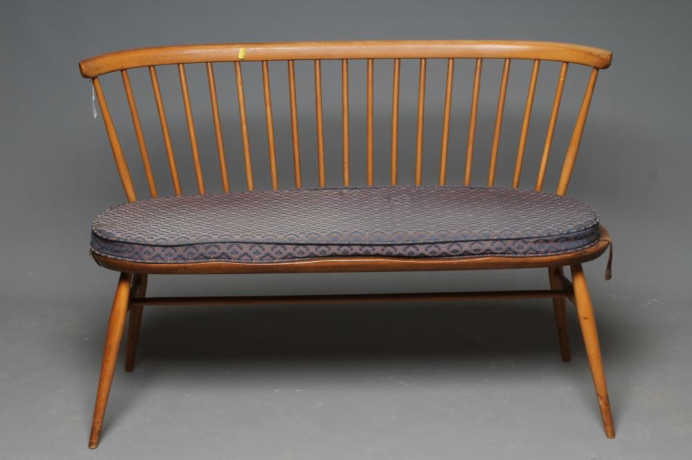 AN ERCOL BEECH AND ELM LOVE SEAT Image