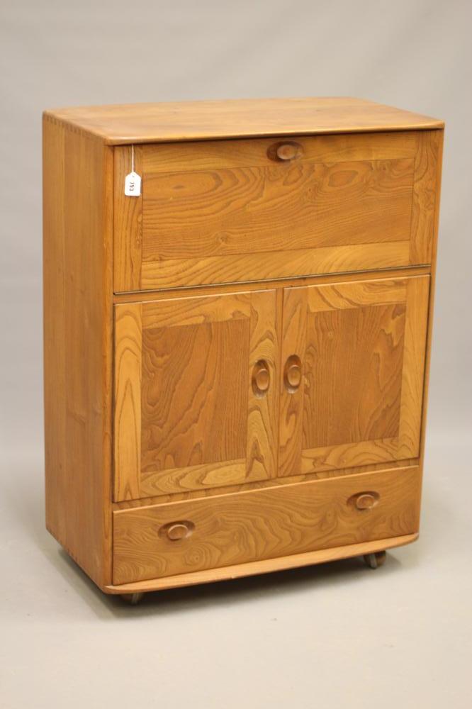 AN ERCOL ELM SECRETAIRE CABINET Image