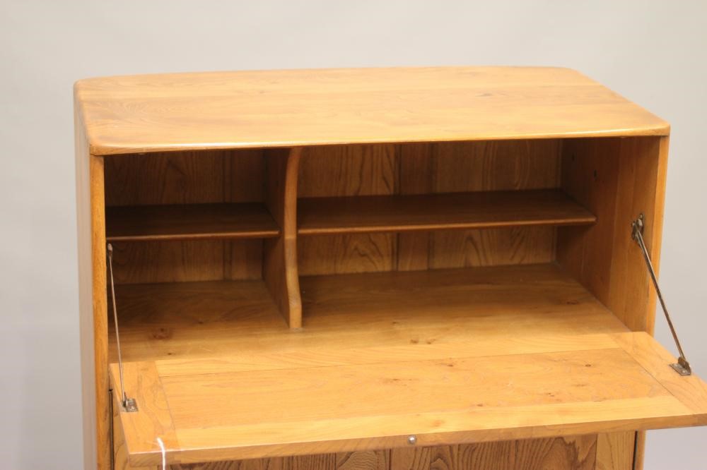 AN ERCOL ELM SECRETAIRE CABINET Image