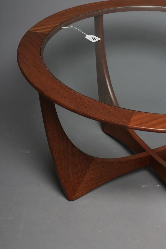 V. B. WILKINS FOR GPLAN - A TEAK ASTRO COFFEE TABLE, the circular top with inset clear glass panel, Image