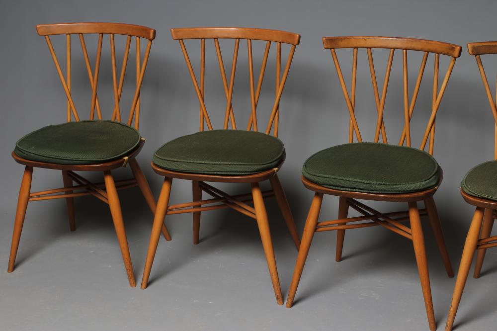 AN ERCOL LIGHT ELM DINING TABLE AND "SHALSTONE" CHAIRS Image
