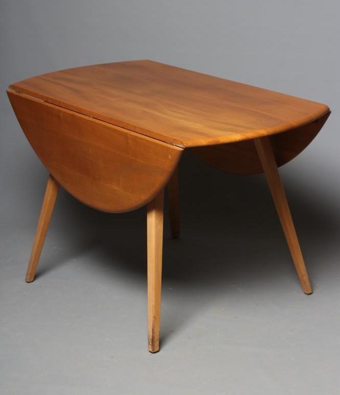AN ERCOL LIGHT ELM DINING TABLE AND "SHALSTONE" CHAIRS Image