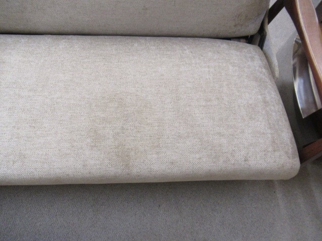 A RETRO TEAK FRAMED LOUNGE SUITE, c.1960's, upholstered in a pale mushroom chenille, comprising a Image