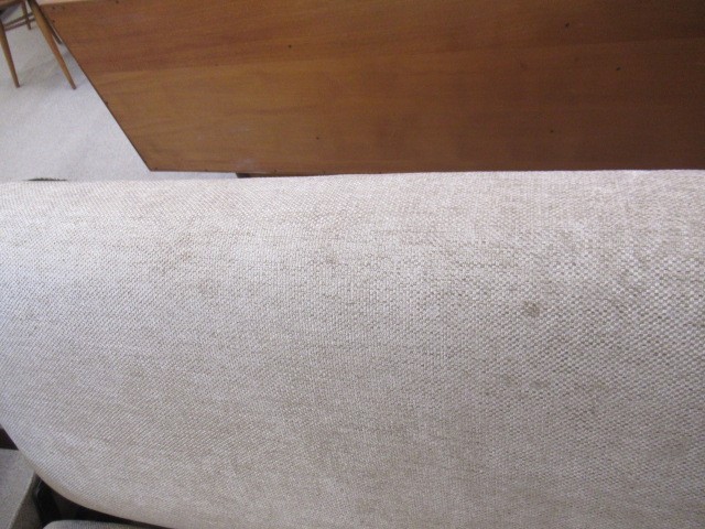 A RETRO TEAK FRAMED LOUNGE SUITE, c.1960's, upholstered in a pale mushroom chenille, comprising a Image